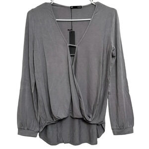 Krisa Revolve Brand NWT’s Surplice long sleeve blouse in concrete. Size XS